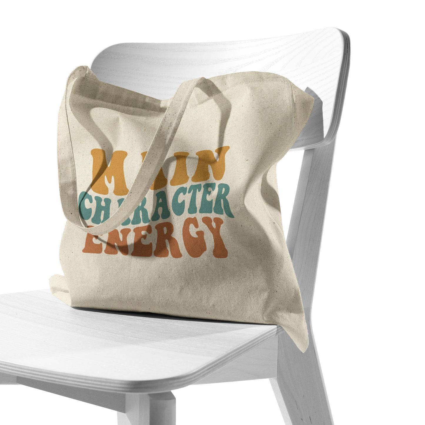 Main_Character_Energy_Tote_Bag_CottonTote_S_Chair_AS_Mockup.png
